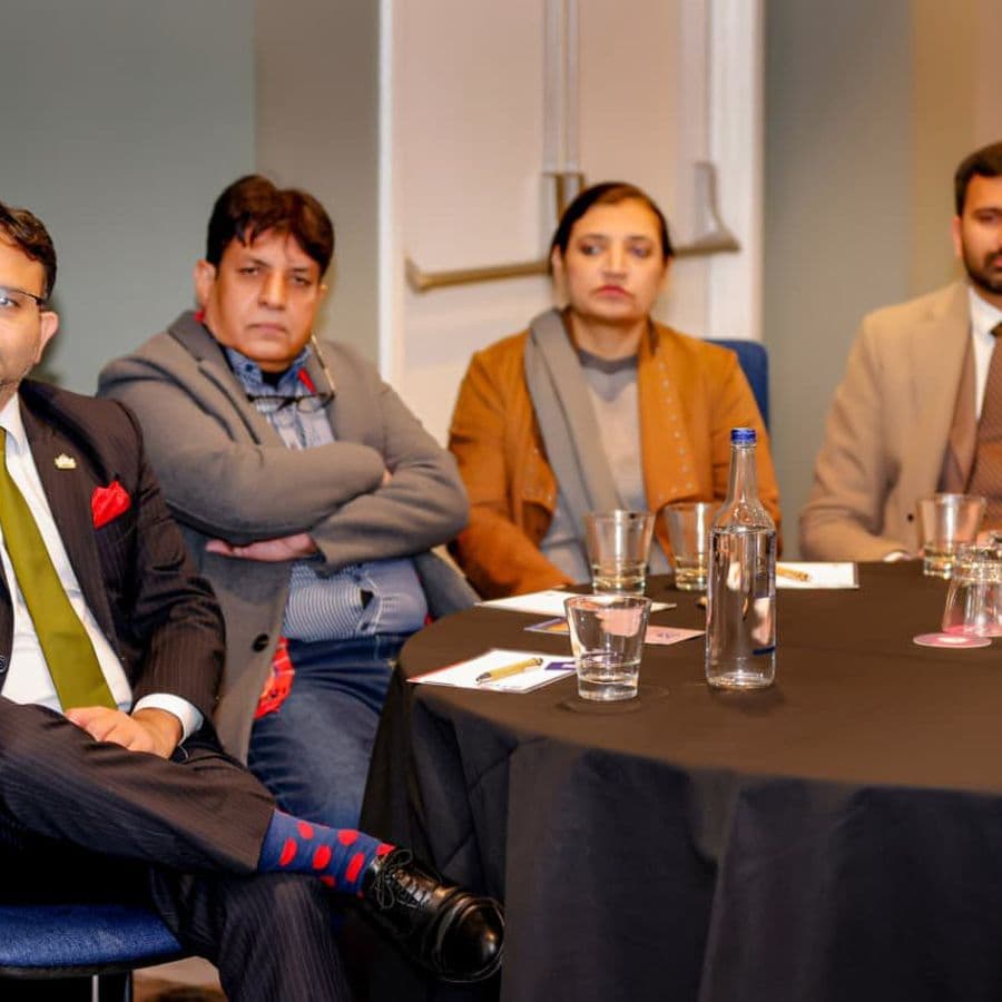 Panellists in conversation during a session