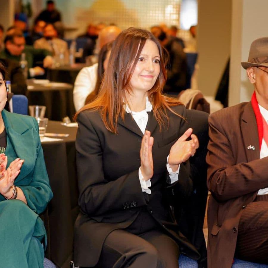 Delegates applauding a speaker