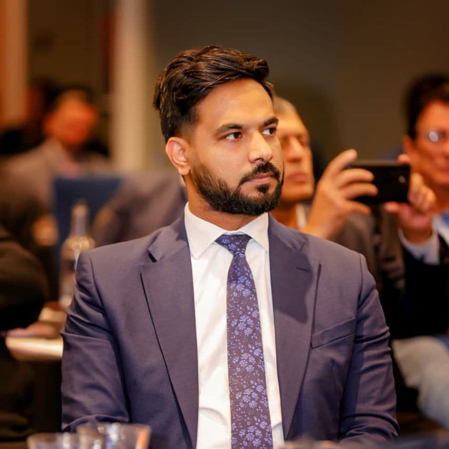 A delegate listening during a session
