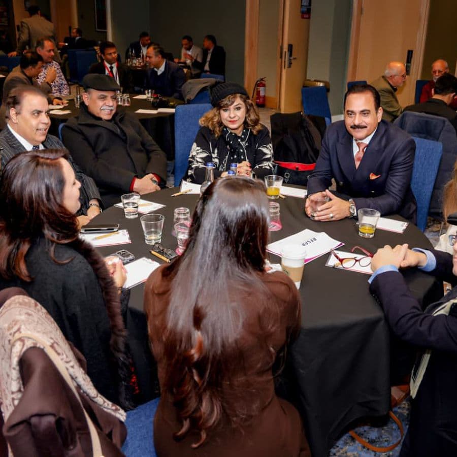 Delegates in discussion at a table